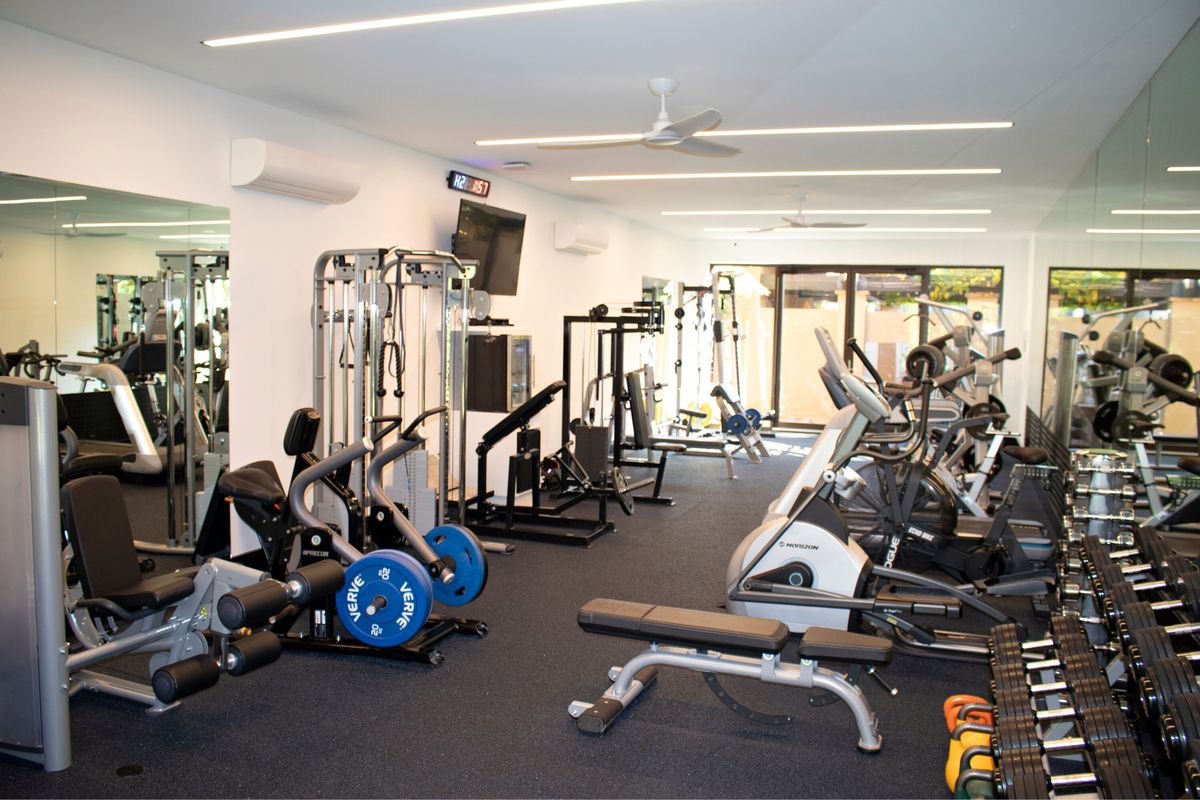 Private gym with strength machines, cable station and cardio